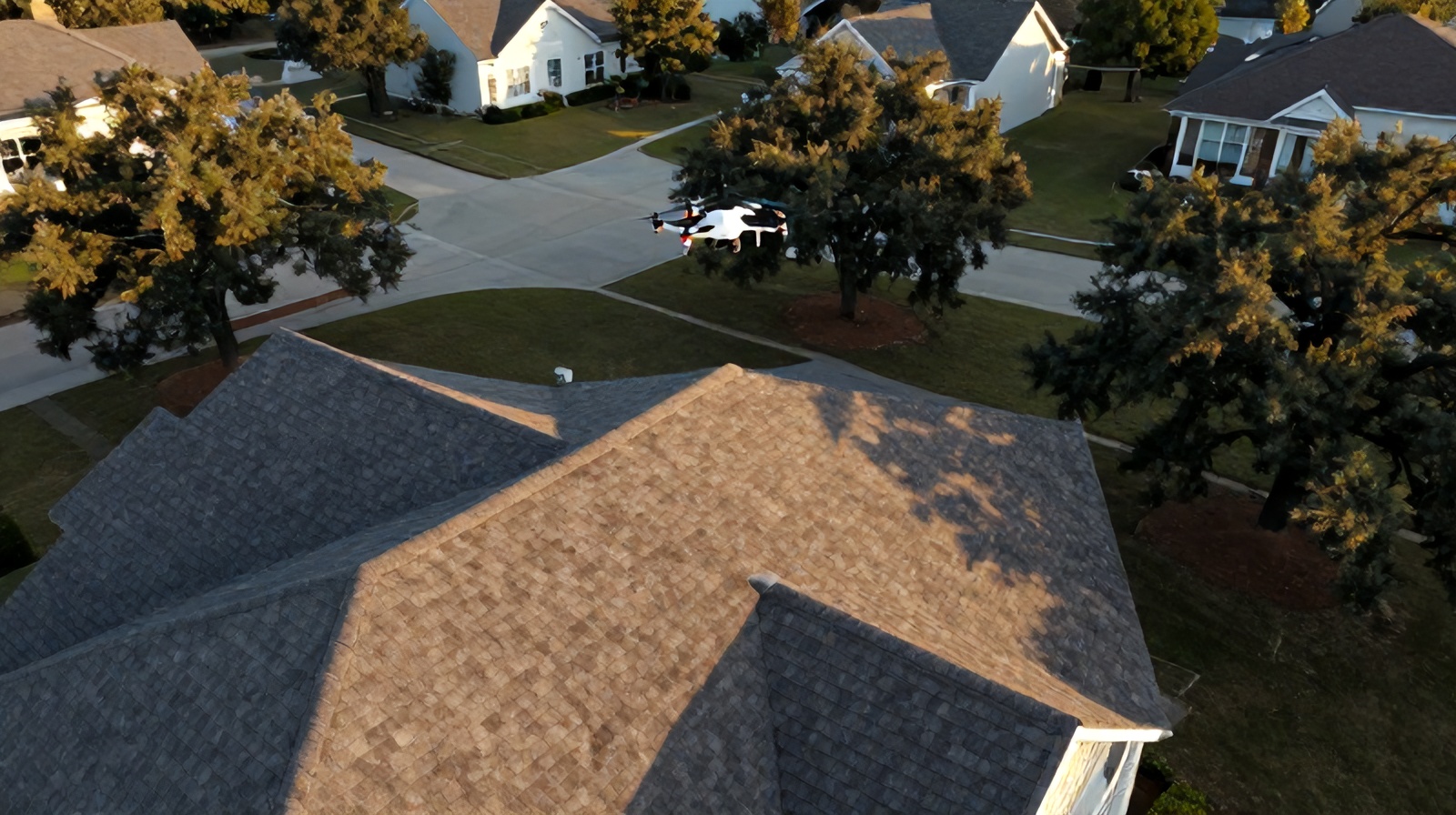 Aerial drone view of a residential rooftop during a shingle inspection near Round Rock, Texas