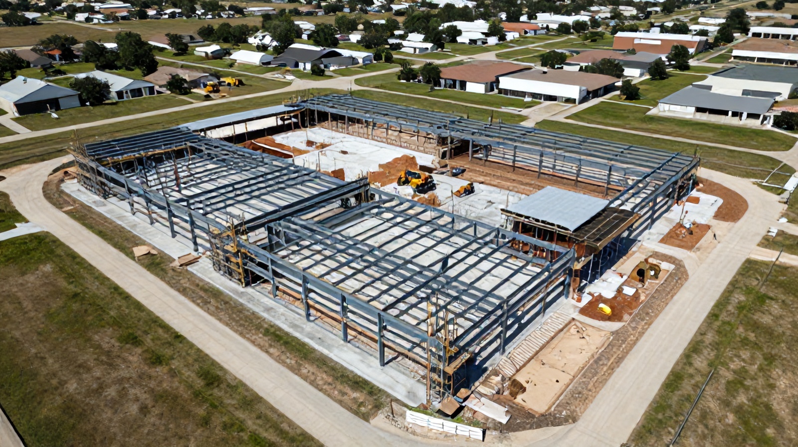 Close aerial view of building framing progress representing catch-early cost savings in construction monitoring