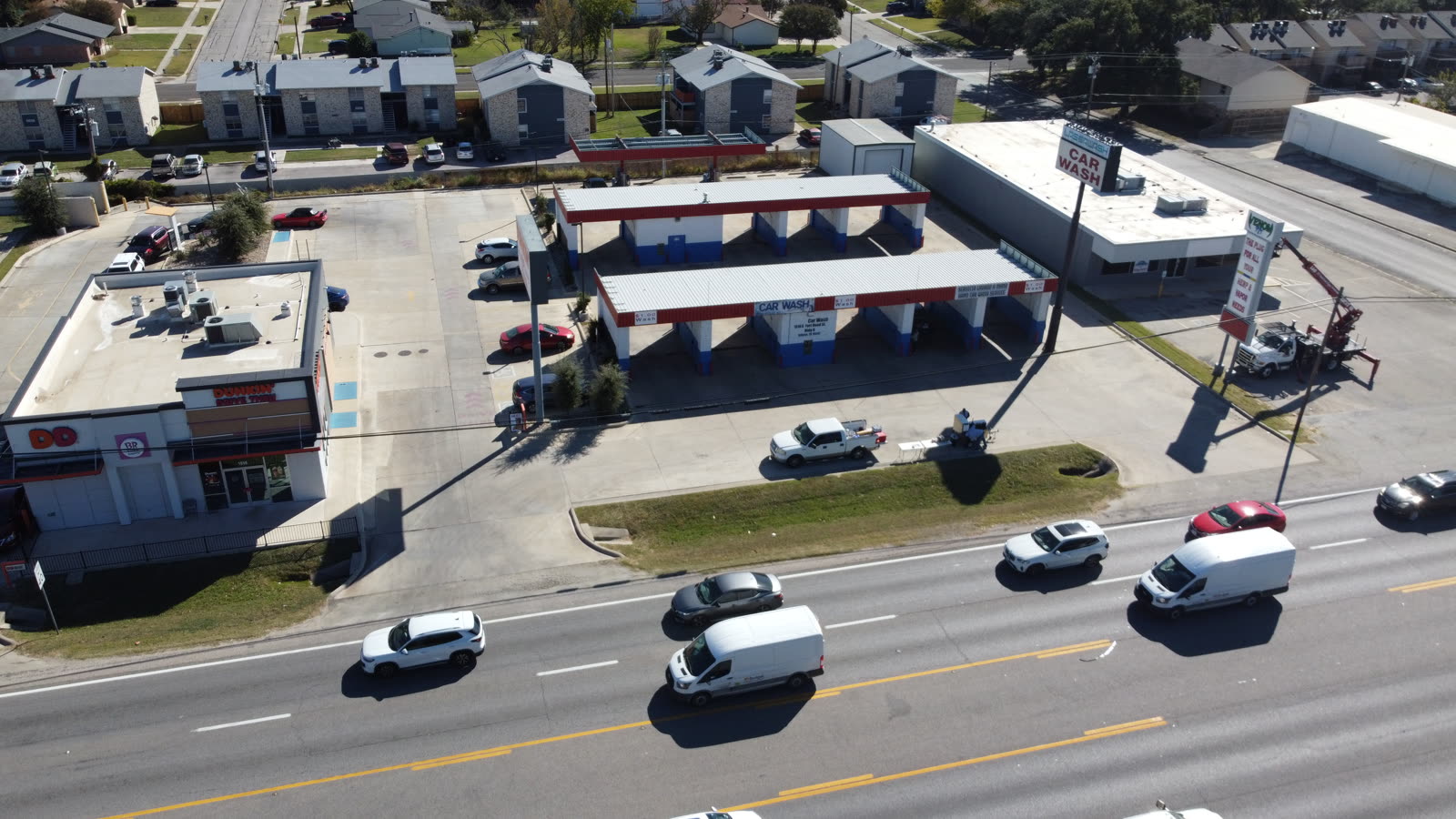 Professional drone capturing marketing footage over a multifamily residential building