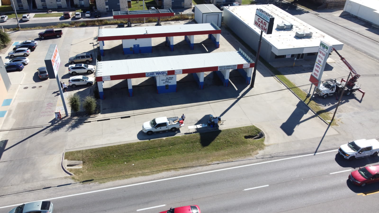 Drone equipped with a thermal camera scanning a commercial roof at dusk