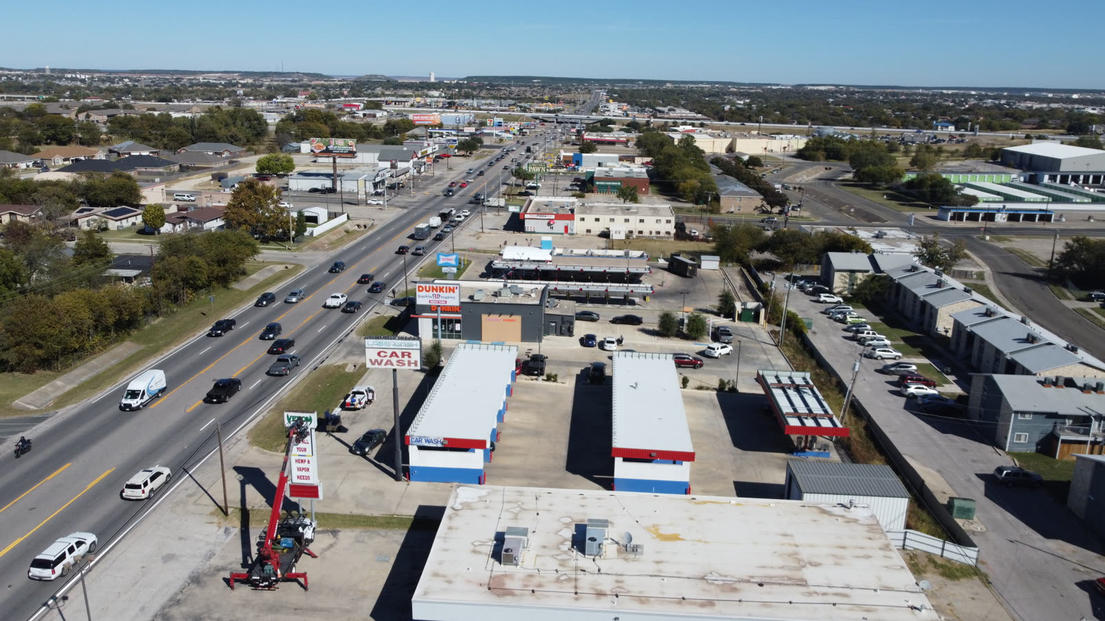 Mapping drone flying a grid pattern over an open construction site