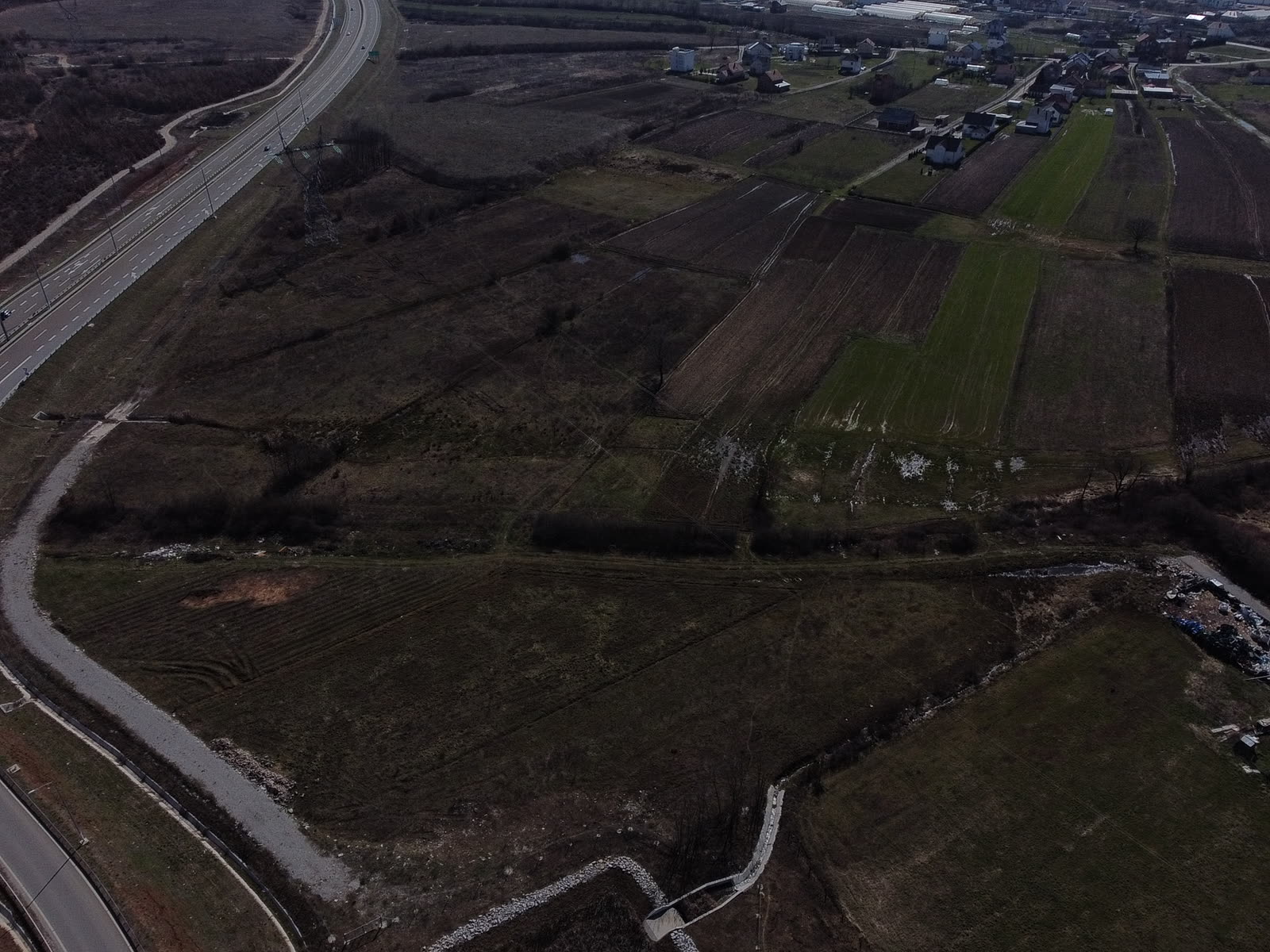 Aerial view of South Austin near Austin-Bergstrom International Airport showing runways and surrounding commercial development